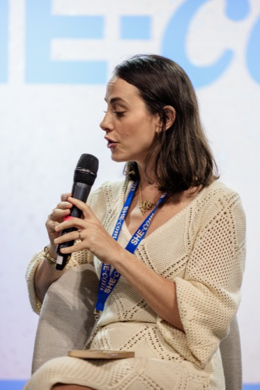 Gabi with a microphone at Online Retailer 2025